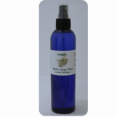 A deep blue spray bottle with 2 ounces of White Sage Mist